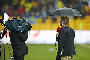 Tv-kommentatorer i regnen